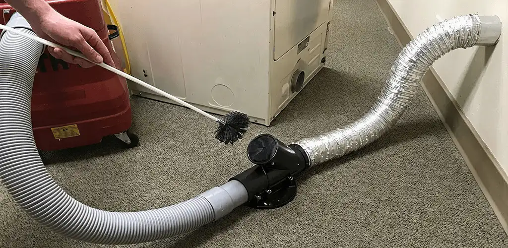 Dryer vent cleaning service removing lint from a dryer duct connection in Saint Petersburg, FL