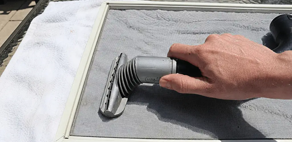 Window screen repair cleaning and fixing a damaged screen mesh in Saint Petersburg, FL