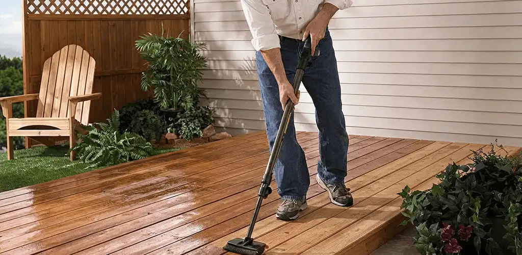 Deck staining service applying stain to a backyard wood deck in Saint Petersburg, FL